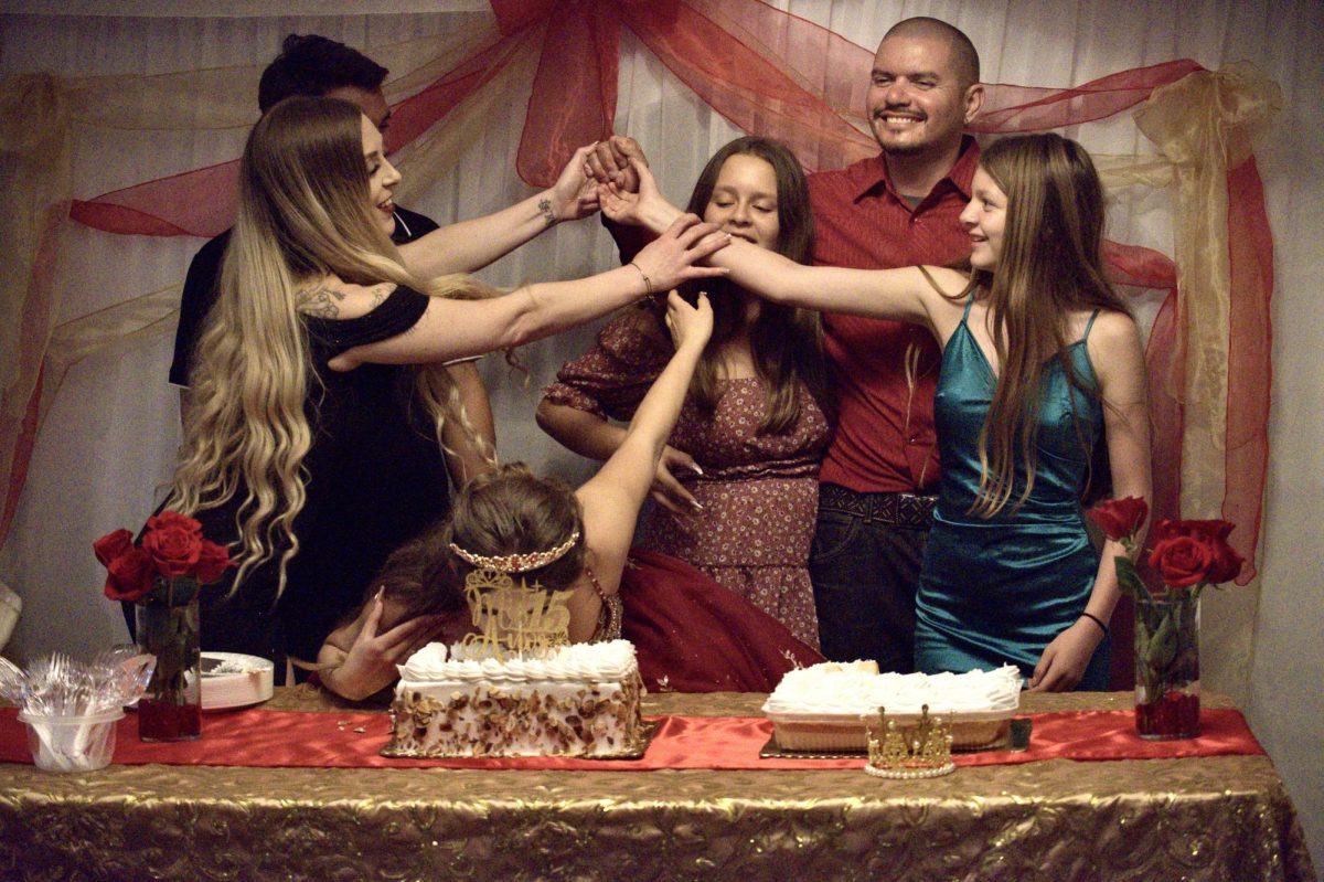 Aubree Morfin’s family stops her dad from shoving her face in the cake.