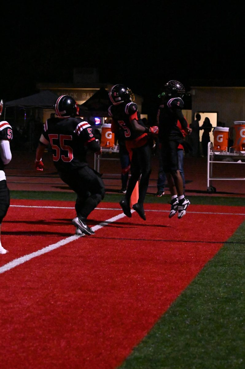 Varsity Boys Celebrate after a touch down.
