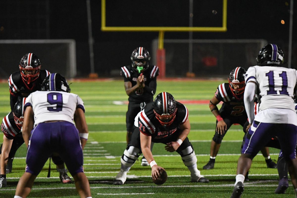 Varsity Boys on offense battling it out against Vista Del Lago.