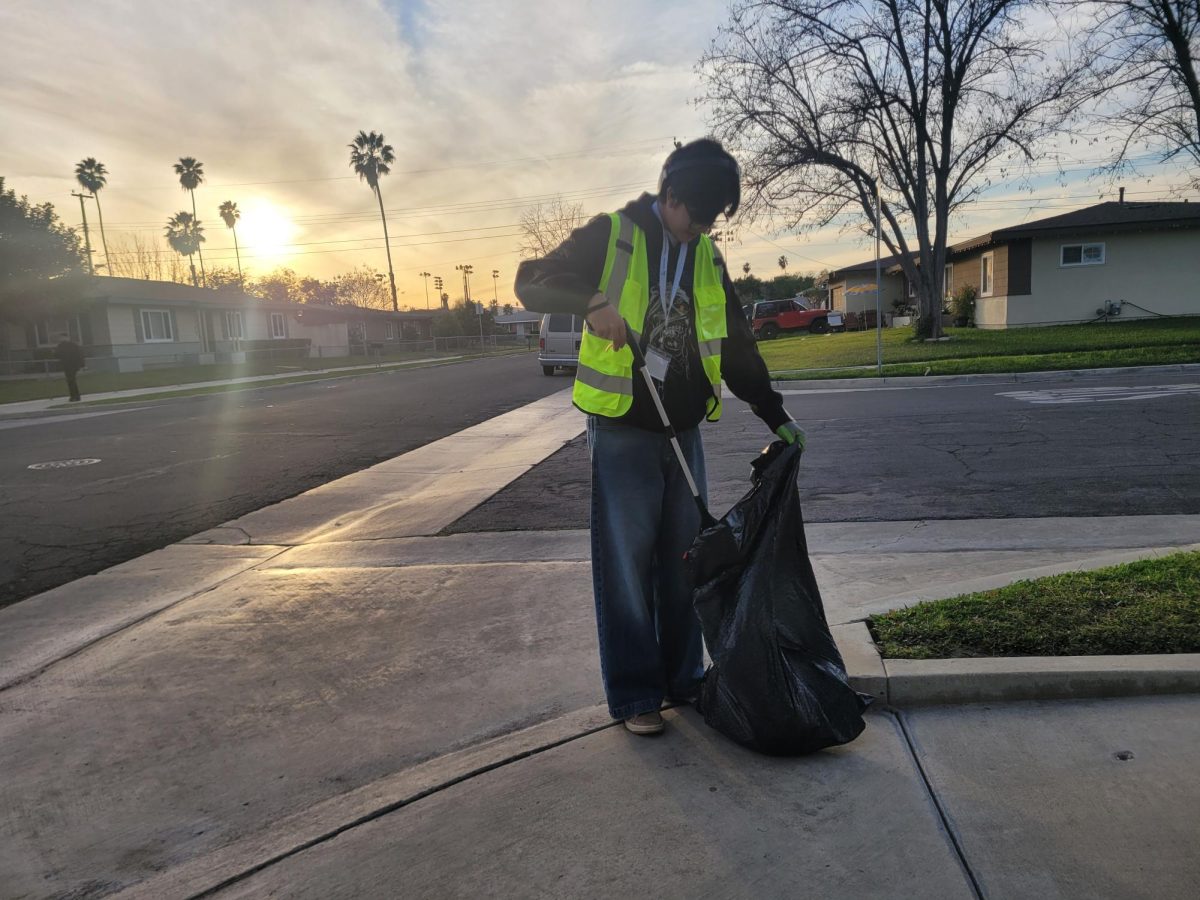 Abel Rangel Duarte Picking up trash at a street cleanup