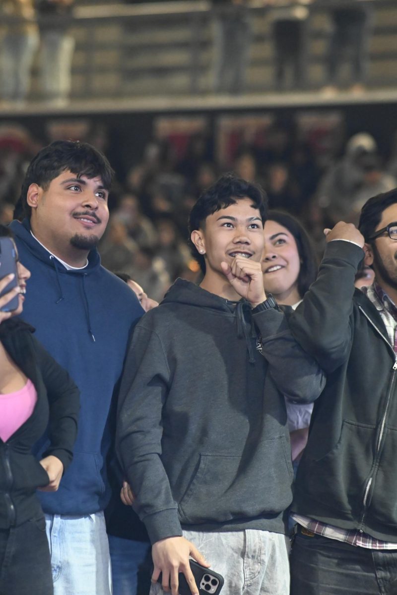 Raven Geroca (12) and Christopher Hernandez (12) watching the VIP Concert