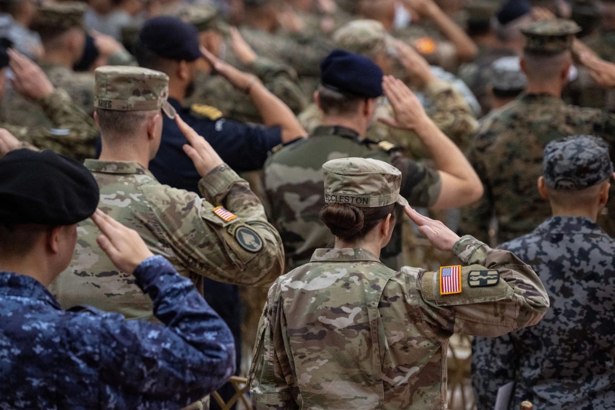 Philippine and U.S. soldiers salute during the flag ceremony at the opening ceremony of the U.S.-Philippines "Balikatan" joint military exercises, at Camp Aguinaldo in Quezon City, Metro Manila, Philippines, April 20, 2026. REUTERS/Noel Celis