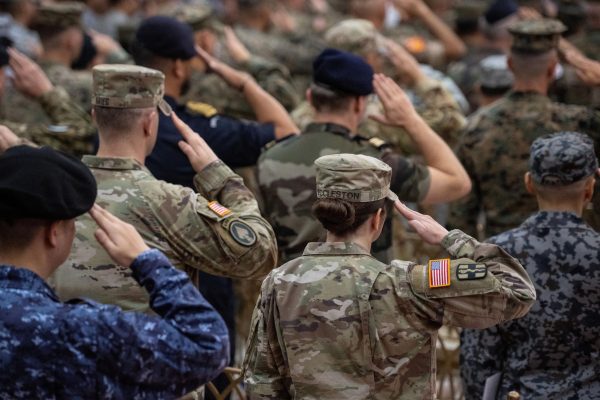 Philippine and U.S. soldiers salute during the flag ceremony at the opening ceremony of the U.S.-Philippines "Balikatan" joint military exercises, at Camp Aguinaldo in Quezon City, Metro Manila, Philippines, April 20, 2026. REUTERS/Noel Celis