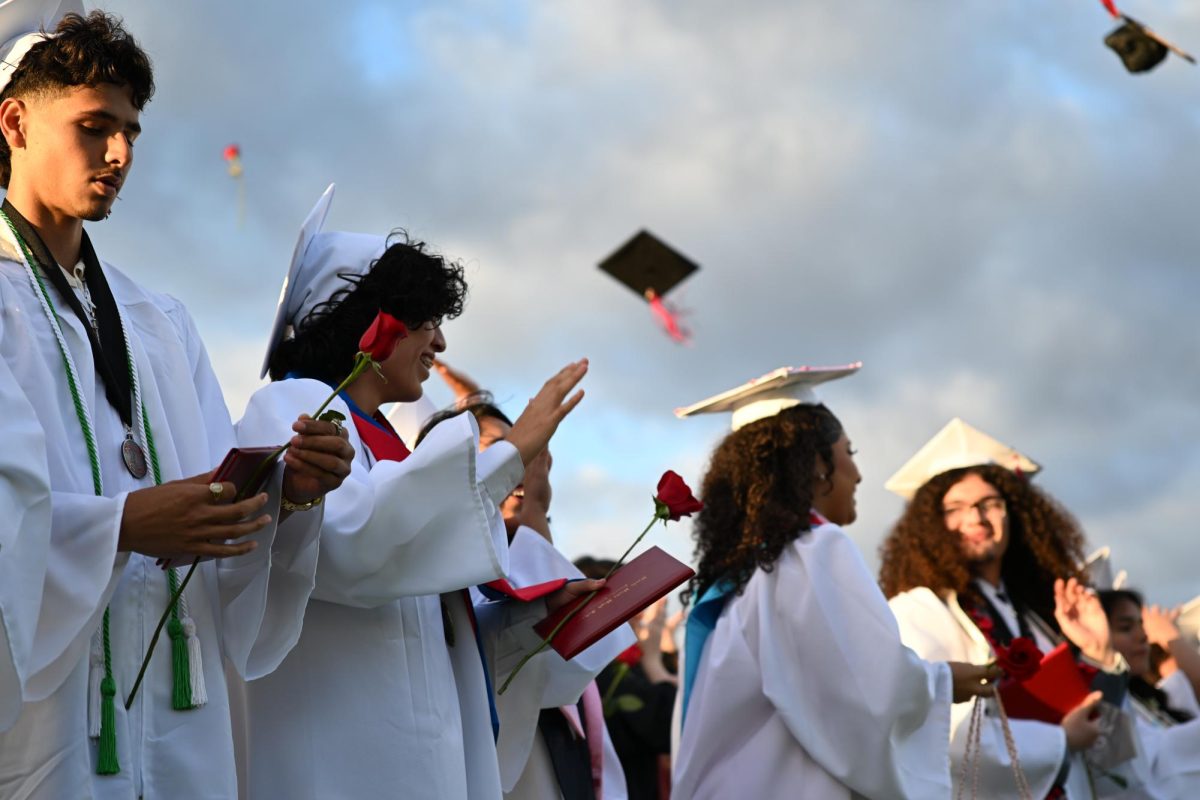Seniors throw their caps to signify the end of their high school career 